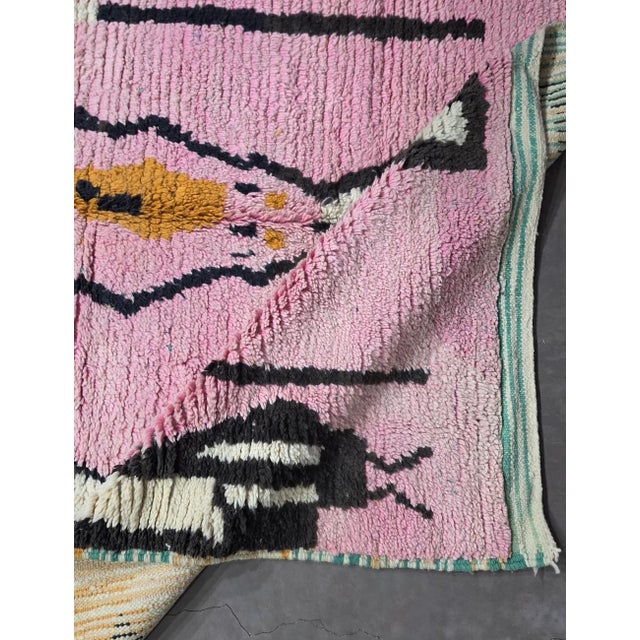 Boujad Rug | Handwoven Berber Wool Rug with Pink Field and Graphic Motifs This bold Boujad rug features a bubblegum-pink...