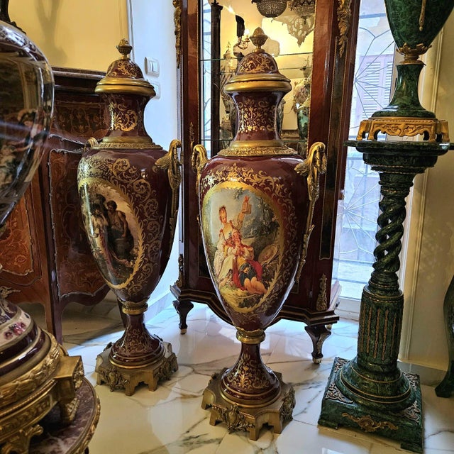 Make a bold statement with this elegant burgundy porcelain vase, designed in a refined French style. The rich guinda...