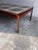 A striking extra-large Danish coffee table dating from the 1970s, featuring a beautifully crafted wooden frame and an...