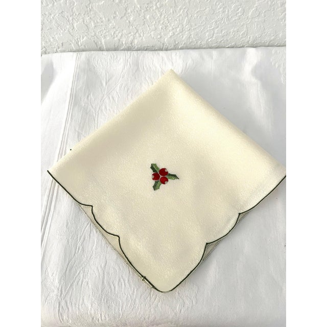 Beautiful set of twelve vintage cream-shaded napkins in a shimmering polyester fabric. Napkins feature green embroidered...