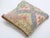 A one-of-a-kind handwoven Afghan wool kilim accent pillow featuring pastel triangle lattice. Cut and sewn by hand from a...