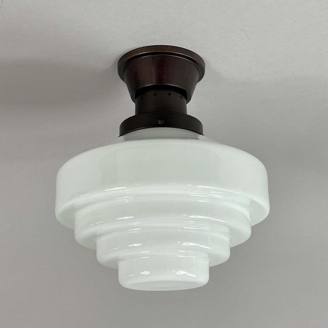 This Art Deco flush mount has been designed and manufactured in Sweden in the 1940s. The light features a classic stepped...