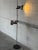 This adjustable metal floor lamp delivers sleek task lighting with two directional spotlight shades. Built with a slender...