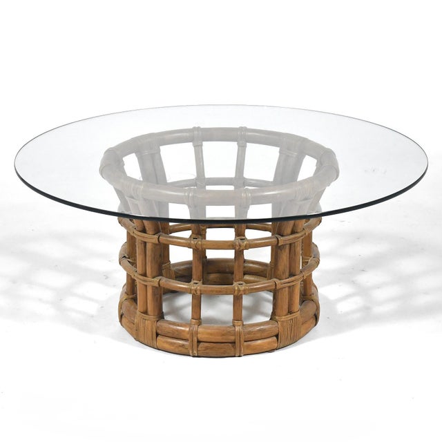 This handsome organic modern coffee table by Brown Jordan has a circular base of rattan with a lovely tobacco leaf finish...