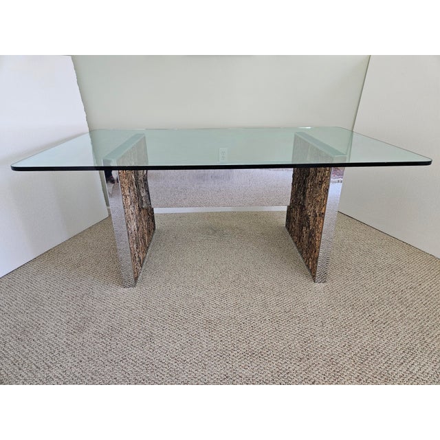 This stylish chrome and cork dining table is attributed to Comfort Designs, Incorporated, an Adrian Pearsall design. The...