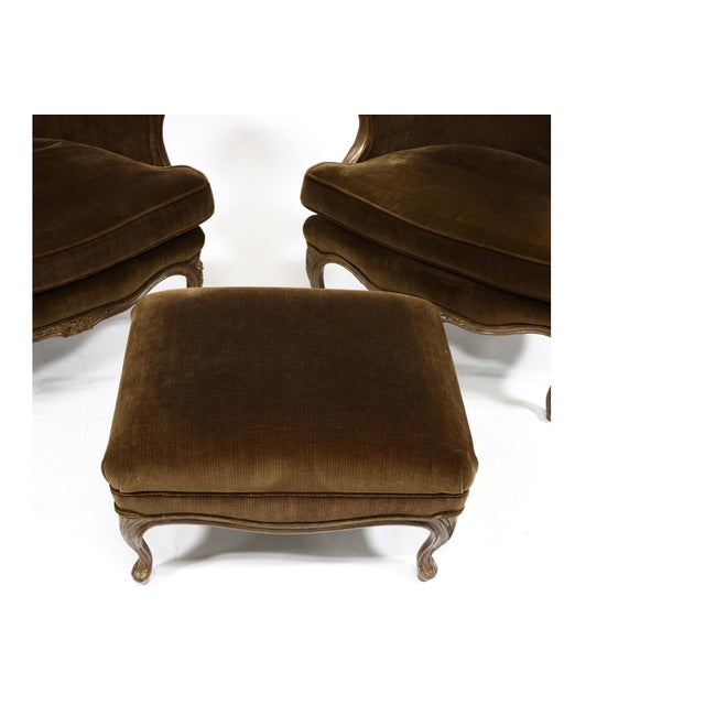 Second half 20th century, carved wood frames with antiqued gilt surface, deep olive plush upholstery with loose serpentine...