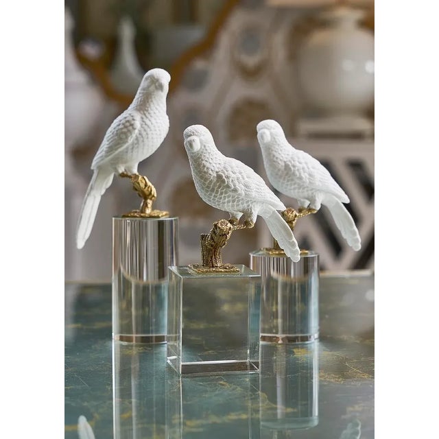 Beautiful white ceramic parrot on crystal base.