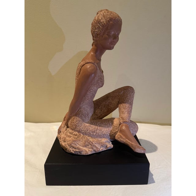 A captivating, mid-century style limited edition terracotta composite sculpture by celebrated American artist Peggy Mach...