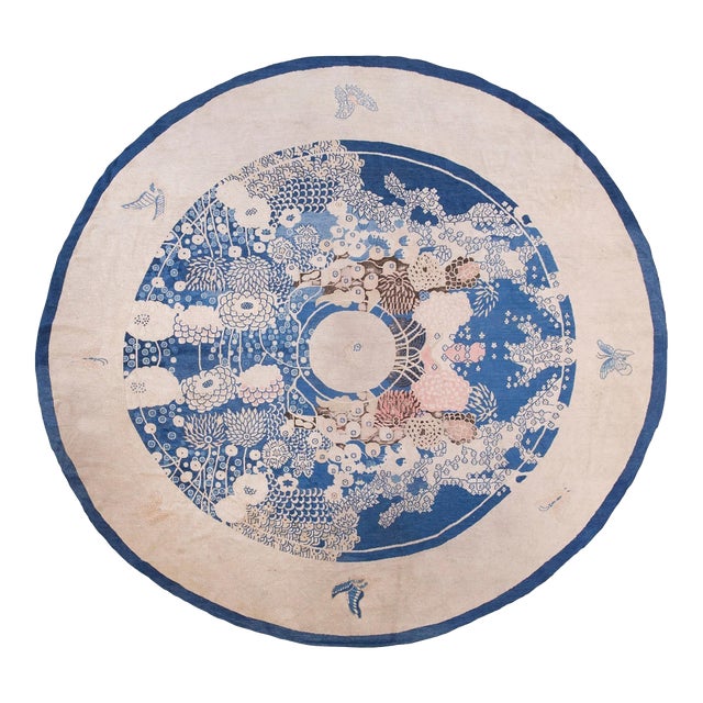 Pretty Floral Design in a Ivory Field & Navy Border Color Antique Round Chinese Peking Rug For Sale