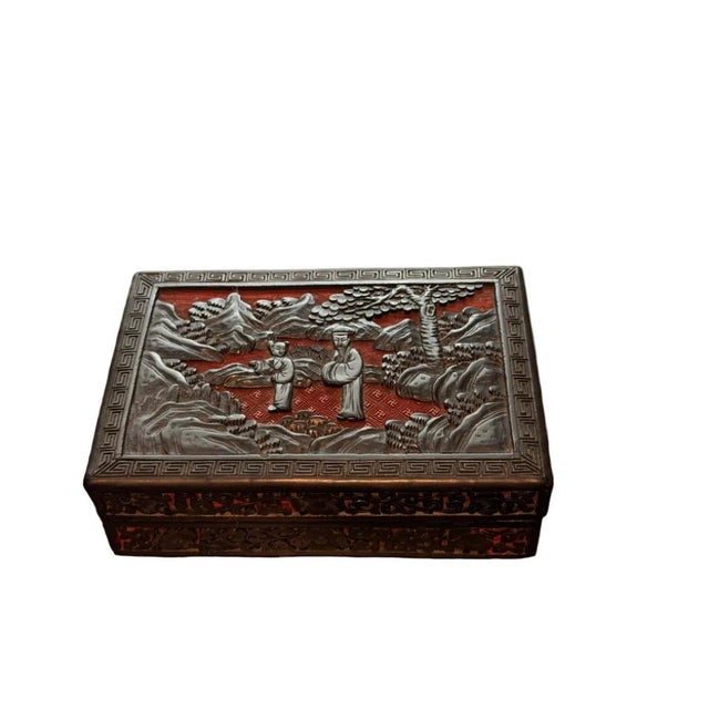 This exceptional antique Chinese cinnabar box represents a remarkable example of traditional lacquerware artistry. Hand-...