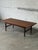 This rectangular coffee table features an extendable design with two pull-out leaves. Its clean lines and tapered legs...