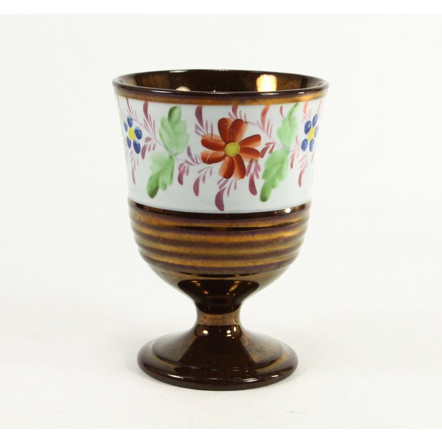 A very lovely Victorian goblet Copper lustre ceramic with enameled hand painted flowers in polychrome palette - red, blue,...