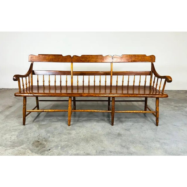 An American 19th century Pennsylvania pine & poplar Windsor bench with half spindles and single board plank seat. At six...