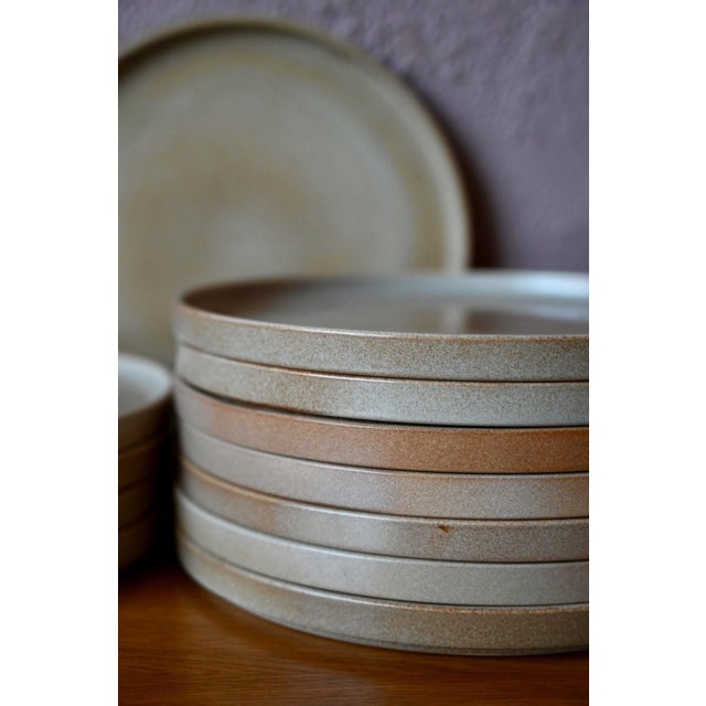 Here is a beautiful set of 12 glazed stoneware dinner plates by Niderviller, evoking the warmth of home cooking and happy...