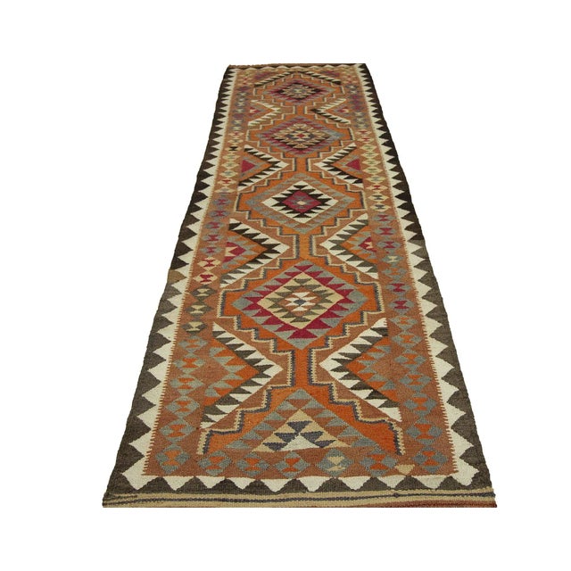 Vintage decorative handwoven kilim runner from South Eastern Turkey.Approximately 45-55 years old. In very good condition.