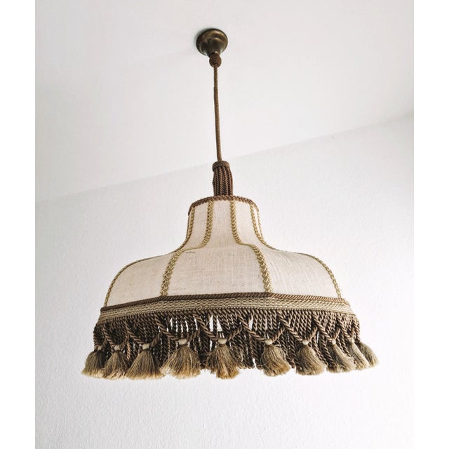 A unique Vintage hanging lamp with natural material shows exquisite craftsmanship, a real gem. The lamp is in wonderful...