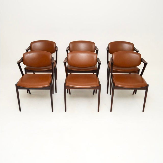 An absolutely stunning set of six Danish vintage model 42 dining chairs by Kai Kristiansen. They were made by cabinetmaker...
