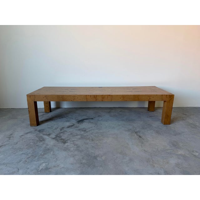 Striking 1970’s Parsons-style coffee table executed in a beautifully bookmatched burl wood veneer, attributed to the...