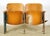 Art Deco style theater seats made of molded plywood backrests and flip-up seats, solid wood armrests, and heavy cast iron...