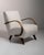Curved-arm lounge chair in Warm Ivory Boucle. Its warm ivory boucle finish sets off sculptural bentwood arms, ivory boucle...