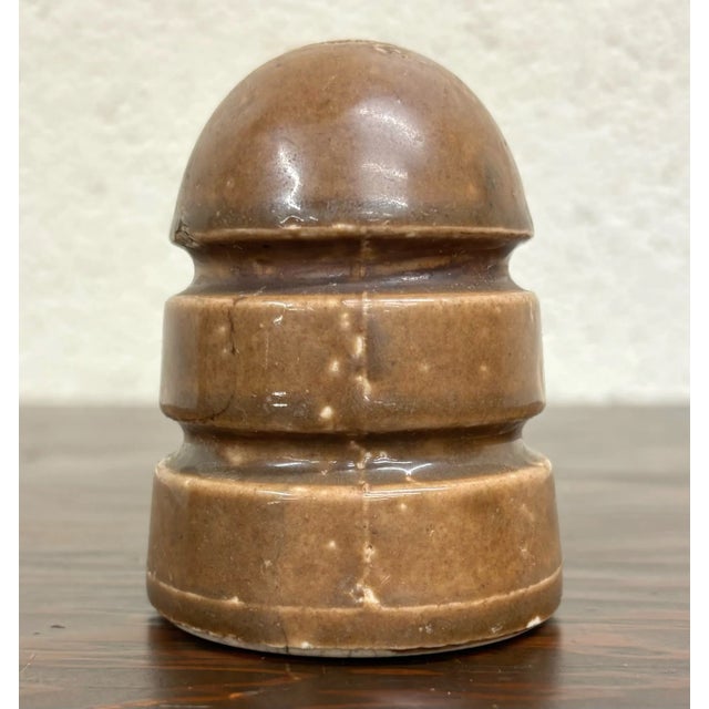This is a gorgeous antique light brown ceramic mushroom cap glazed insulator with a gorgeous color. “G” on top is hard to...
