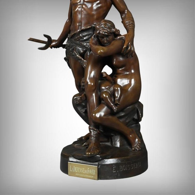 Powerful and moving, this large bronze group with a brown patina, entitled "The Defense of the Home," forcefully embodies...