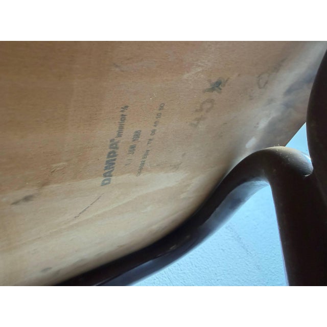 This set of four vintage stacking chairs showcases a clean, functional Mid-Century Modern design with an industrial edge....