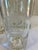 A distinctive set of four vintage clear glass tumblers decorated with etched streetcar or trolley motifs. The frosted...