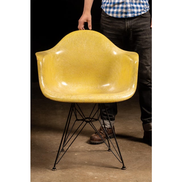 An iconic vintage DAR molded fiberglass armchair designed by Charles and Ray Eames and manufactured by Herman Miller in...
