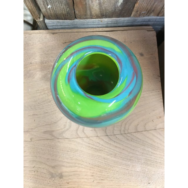 Vintage hand blown art glass in a swirl pattern, signed. The colors are so vibrant and beautiful in lime green, turquoise...