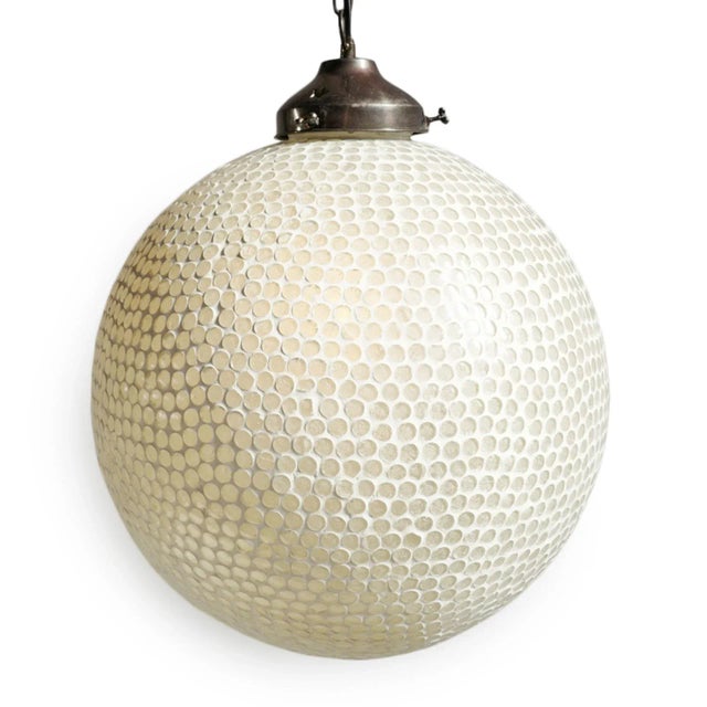 White mosaic globe pendant lantern. Hand crafted in India with beautiful white mosaic glass. Includes 3' chain and ceiling...