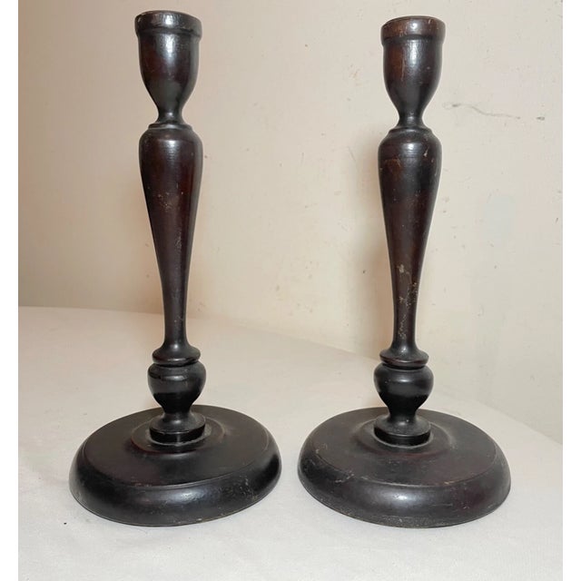 Up for sale is a wonderful pair of antique 19th century hand turned English wood and brass candlesticks. They are made...