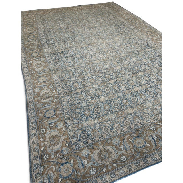 Bring timeless character and understated elegance to your home with this beautiful vintage hand-knotted Tabriz Persian rug...