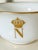 Crafted from smooth, opaque milky glass, this vessel features a printed reproduction of the iconic Napoleonic imperial...