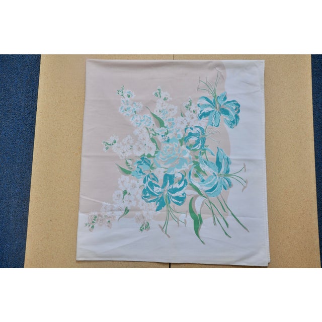 Cotton printed mid-century tablecloth with pink and teal floral pattern. Excellent Condition.