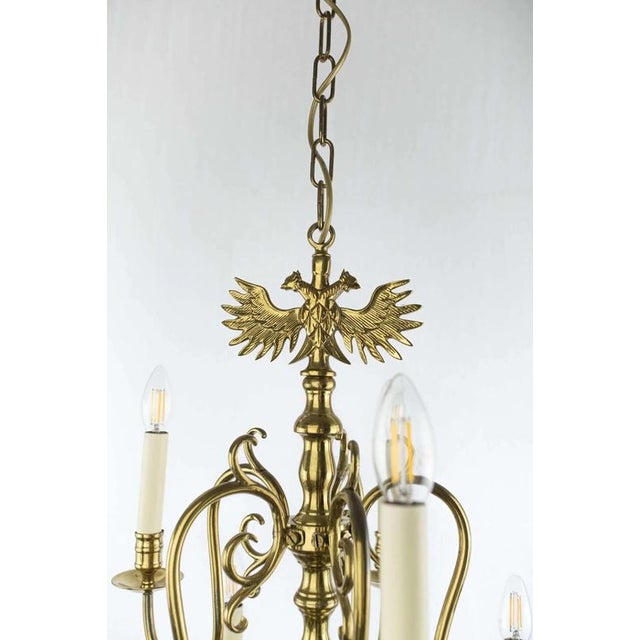 Beautiful dutch-style chandelier made of polished brass with a fine patina. Three-story chandelier with 15 arms. The...