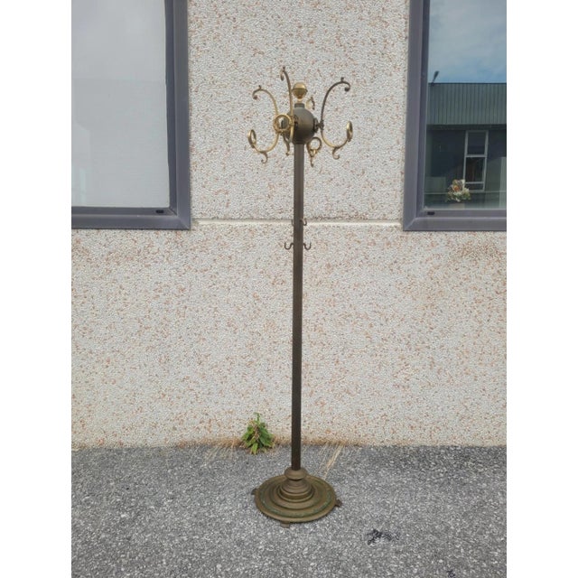 Vintage gilded brass coat stand, second half of the 20th century. Stable and heavy structure, with four gilded bronze...
