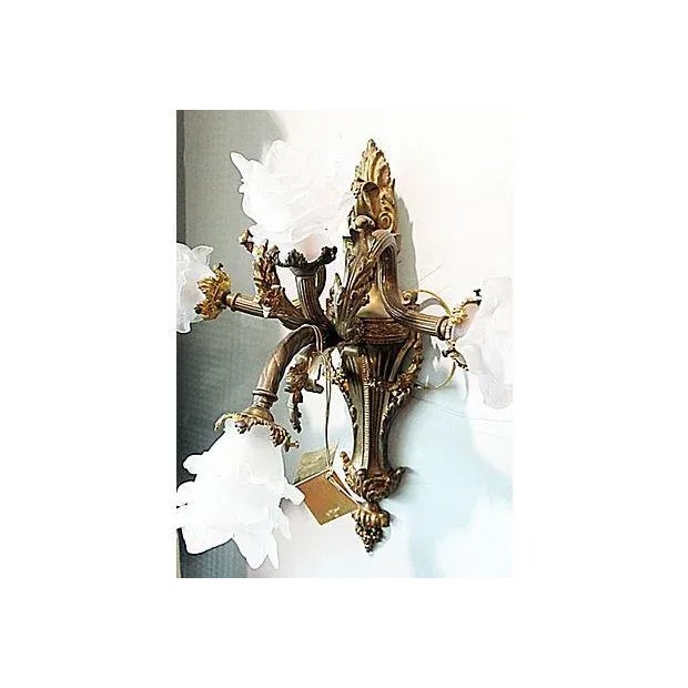 Make an impression with this striking and elegant 19th-century French sconce with worn bronze 23k gold doré finish and...