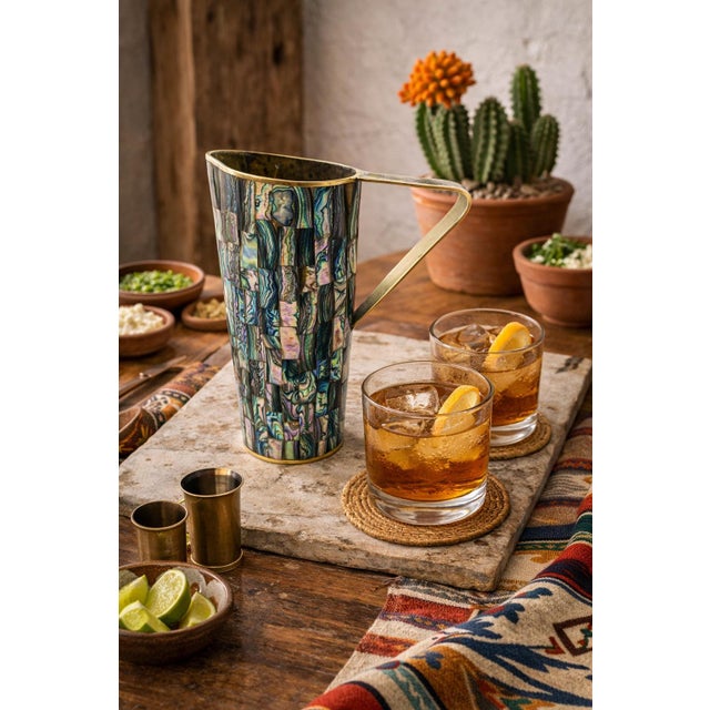 Striking mid-century Mexican Modern water pitcher designed and produced by the celebrated Los Castillo silversmith...