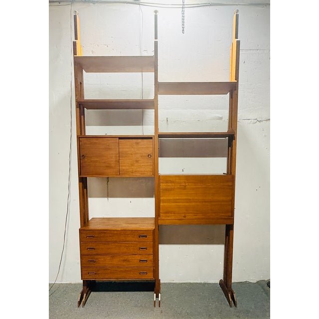 A refined Italian modular bookcase from the 1960s, an authentic expression of mid-century modern design. Crafted from...