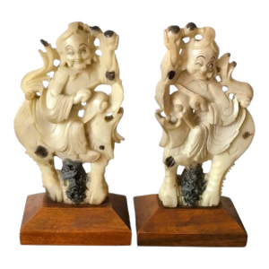 Pair of 19th Century Carved Stone Qilin Rider Sculptures on Wooden Bases.