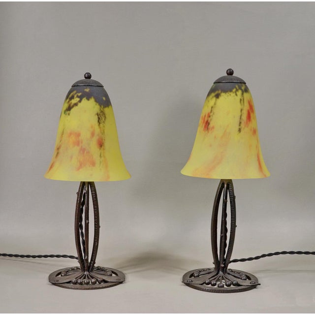 Edmond Gauthier & Daum A wonderful pair of 1925-30 French art deco lamps in wrought iron of outstanding quality produced...
