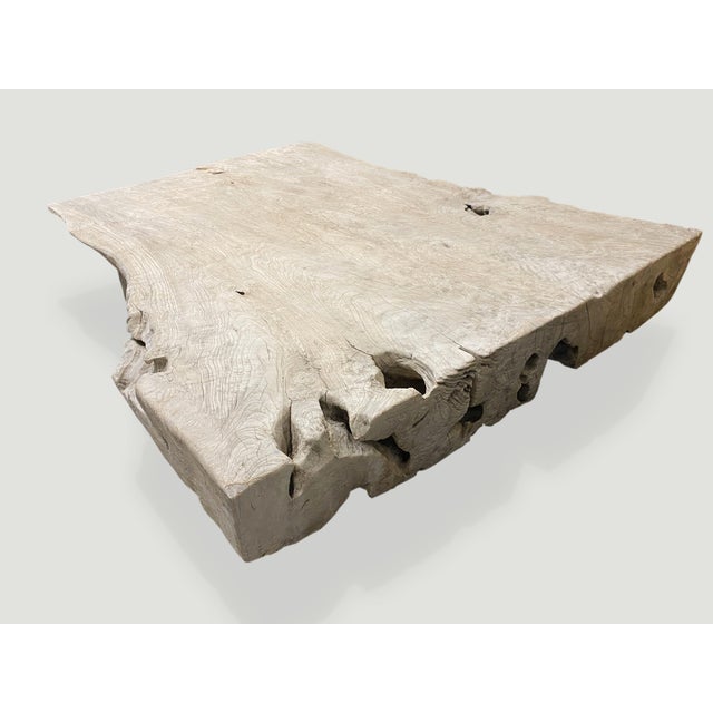 Impressive reclaimed teak wood coffee table celebrating the natural cracks and crevices that time and loving use have left...