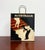 A hand-painted metal magazine holder inspired by Leonetto Cappiello’s iconic Nitrolian advertising poster. Featuring the...