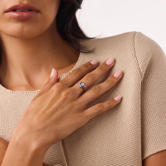 This elegant Art Deco diamond and synthetic sapphire ring is a timeless 1920’s design, centered by an old European cut...