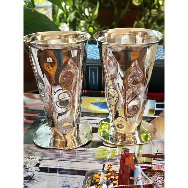 Elevate a tabletop or mantel with this elegant pair of sculptural silverplate bud vases by designer Izabel Lam, New York....