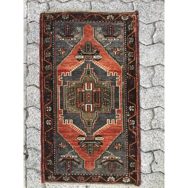This is a vintage Turkish Oushak rug from the 1960s. The piece was hand-knotted.