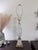 A sophisticated Hollywood Regency or French Empire style table lamp featuring a heavy pressed clear glass baluster urn...