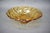 Decorative amber pressed glass bowl produced in Czechoslovakia during the 1960s. The bowl features a sculptural geometric...