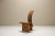 This chair immediately stands out due to the use of light wood with a warm terracotta color. This color gives the chair a...